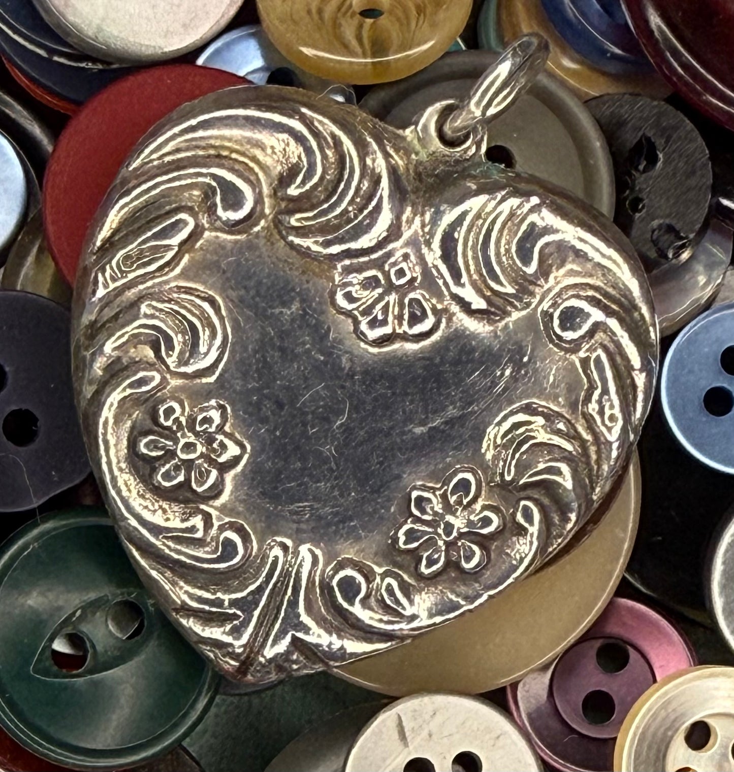 Victorian Sterling Silver Heart Pendant with Repousse Floral Motif