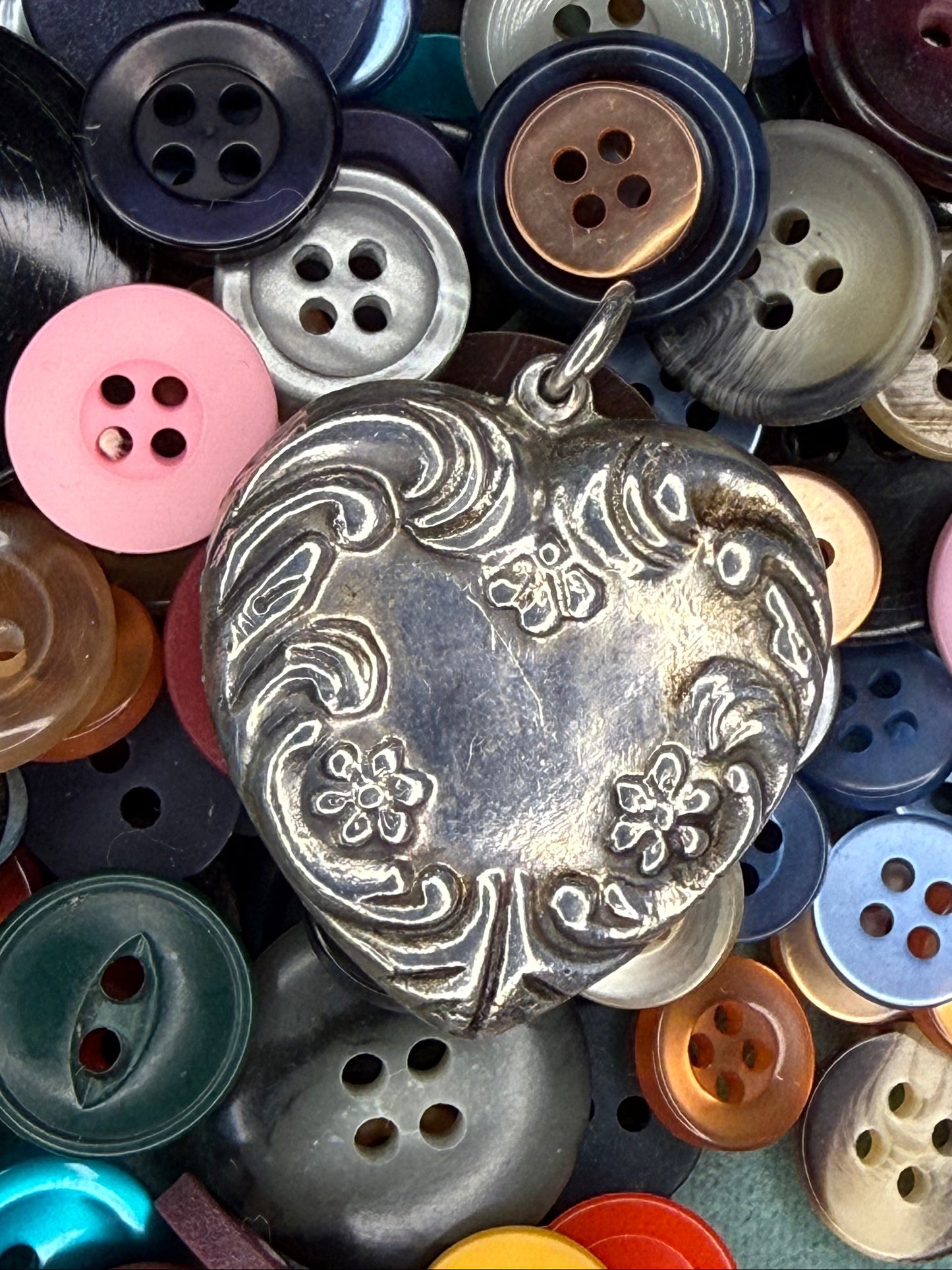 Victorian Sterling Silver Heart Pendant with Repousse Floral Motif