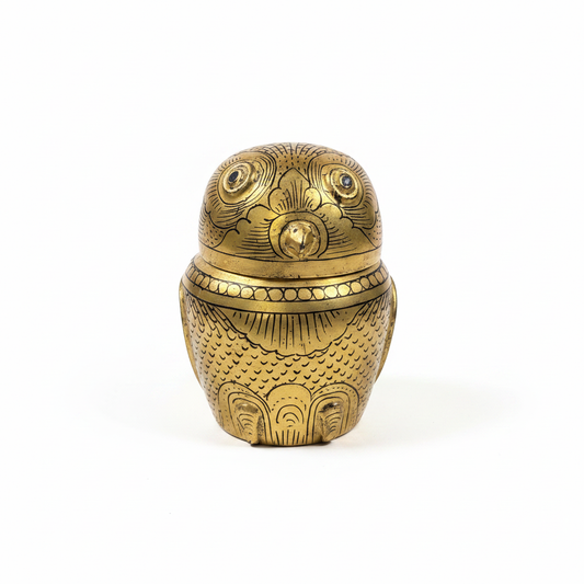 Brass owl box on white background